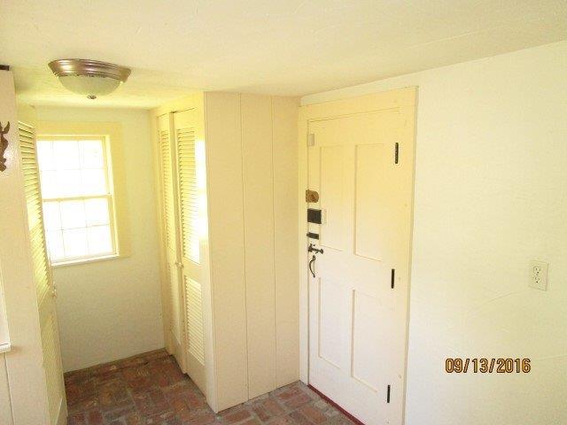 46 Main Street Brewster, MA 02631 - Photo 9 of 19 a view of a bathroom with a shower and a door