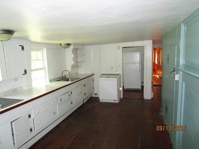46 Main Street Brewster, MA 02631 - Photo 10 of 19 a spacious bathroom with a double vanity sink and mirror