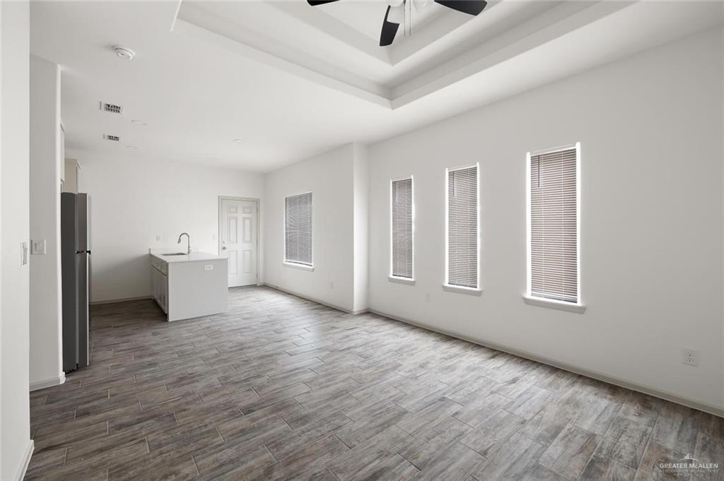 1024 Palm Drive, Unit 1 Alamo, TX 78516 - Photo 4 of 9 a big room with wooden floor and windows