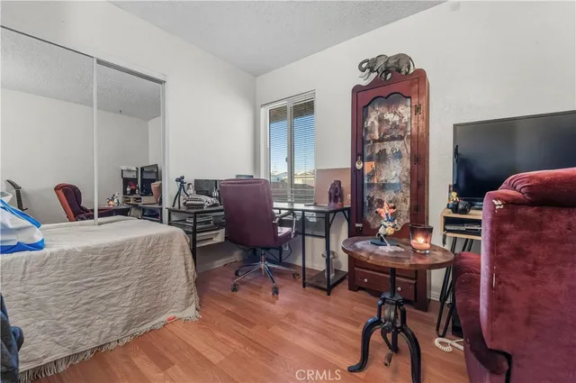 a room with a table chairs and a workspace