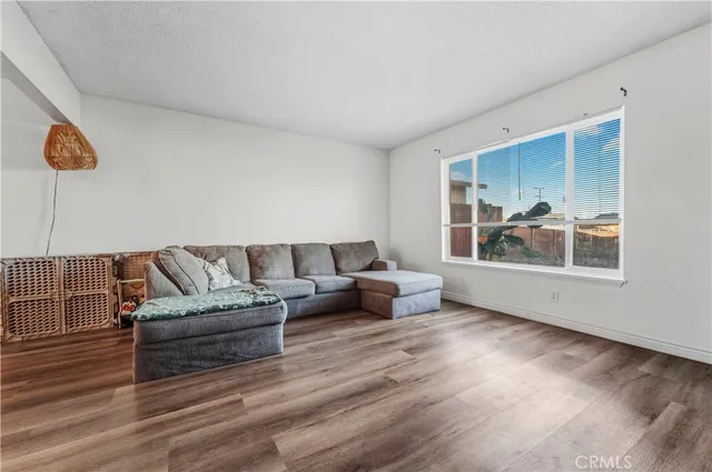 a living room with furniture and window