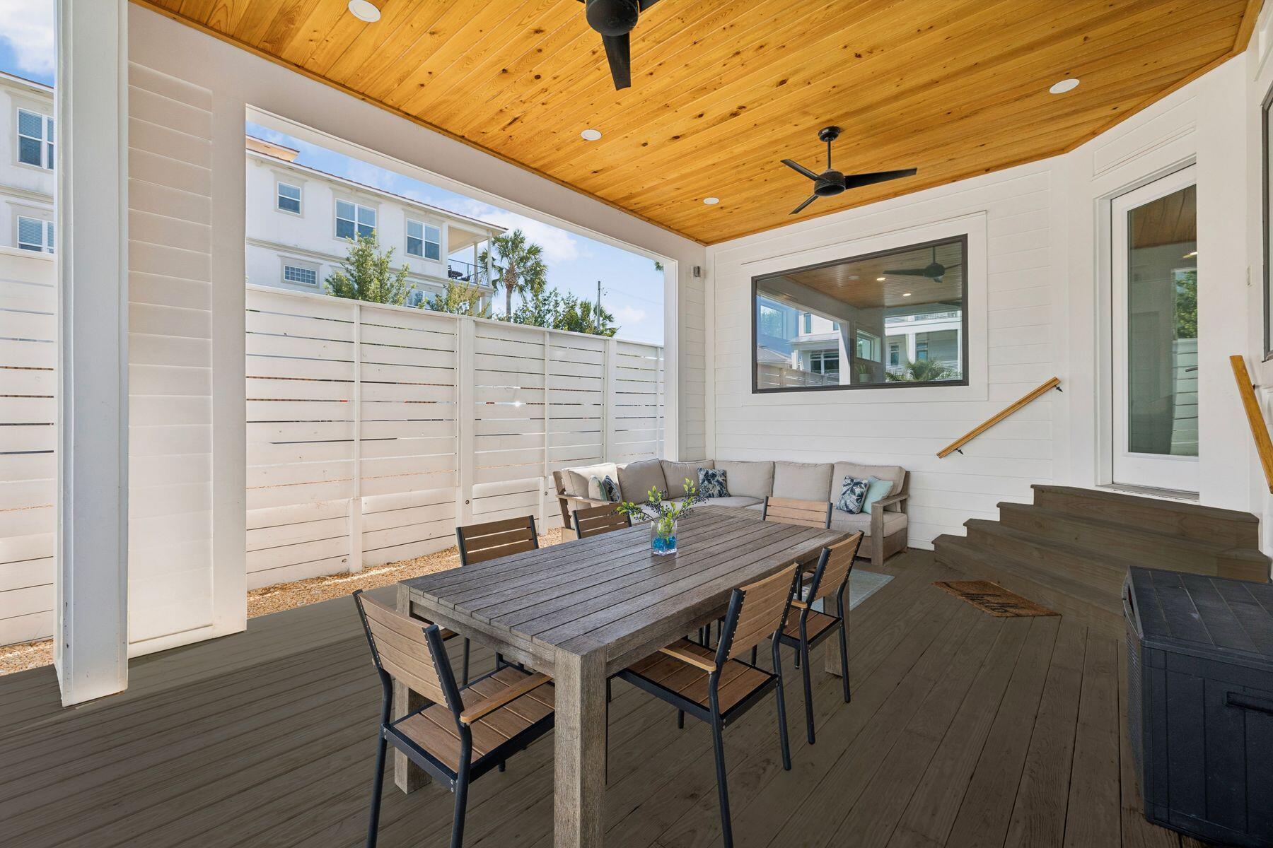 58 Santa Clara Street Santa Rosa Beach, FL 32459 - Photo 11 of 49 a view of a dining room with furniture and wooden floor