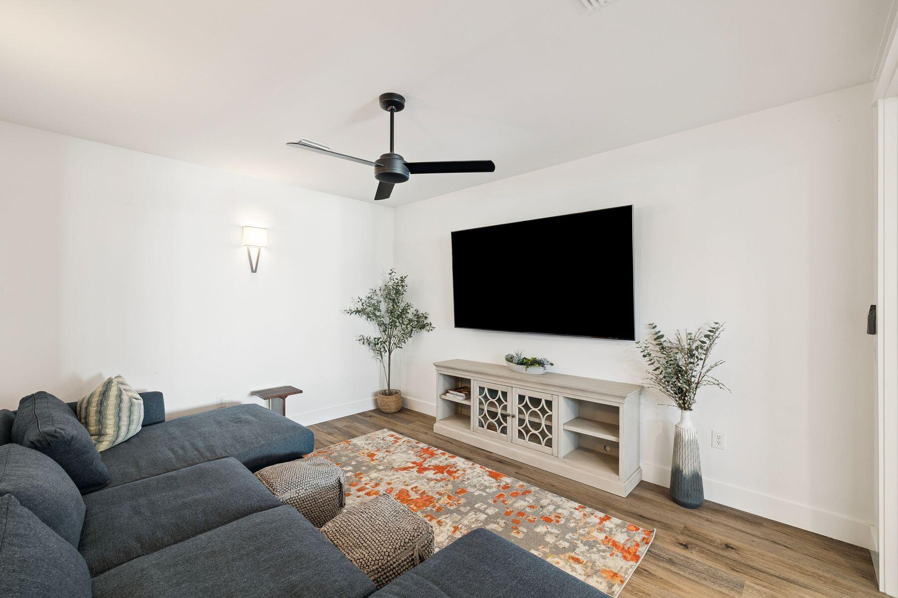 58 Santa Clara Street Santa Rosa Beach, FL 32459 - Photo 21 of 49 a living room with furniture and a flat screen tv