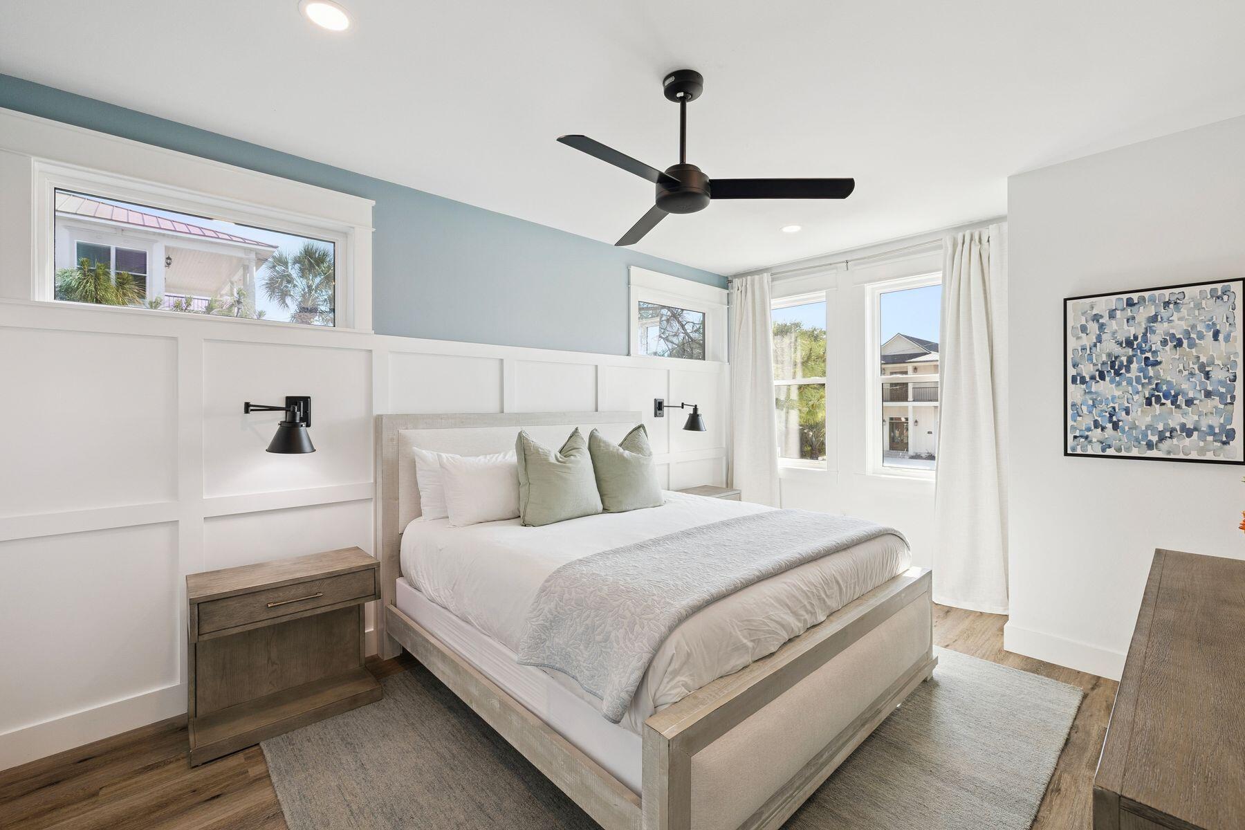 58 Santa Clara Street Santa Rosa Beach, FL 32459 - Photo 23 of 49 a bedroom with a large bed and a chandelier