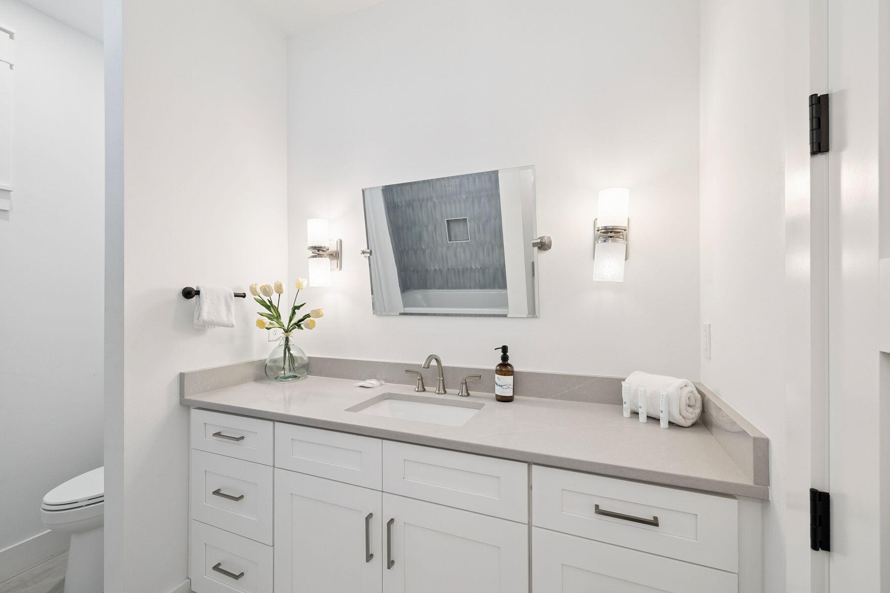 58 Santa Clara Street Santa Rosa Beach, FL 32459 - Photo 30 of 49 a bathroom with a granite countertop sink and a mirror