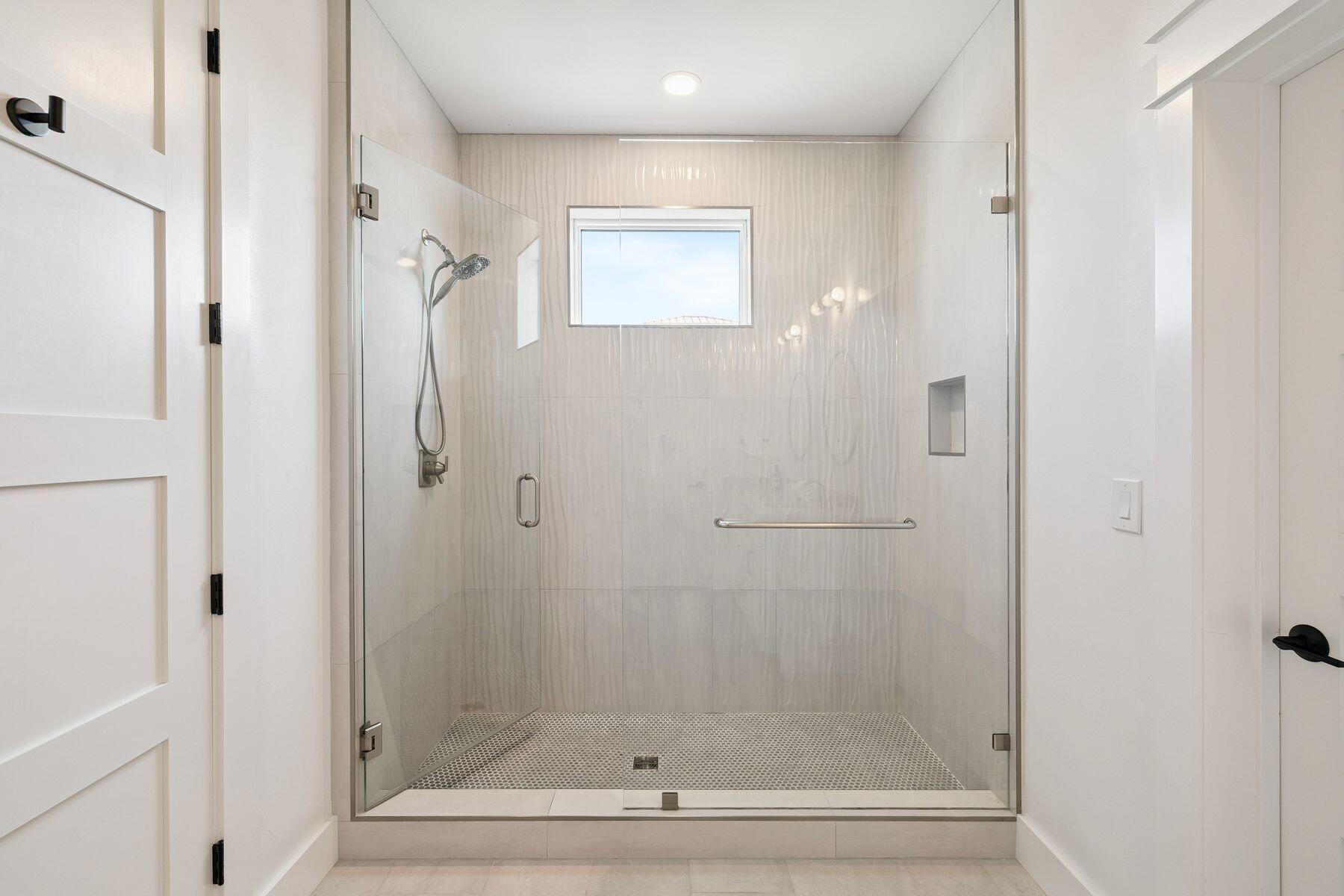 58 Santa Clara Street Santa Rosa Beach, FL 32459 - Photo 38 of 49 a bathroom with a glass shower door