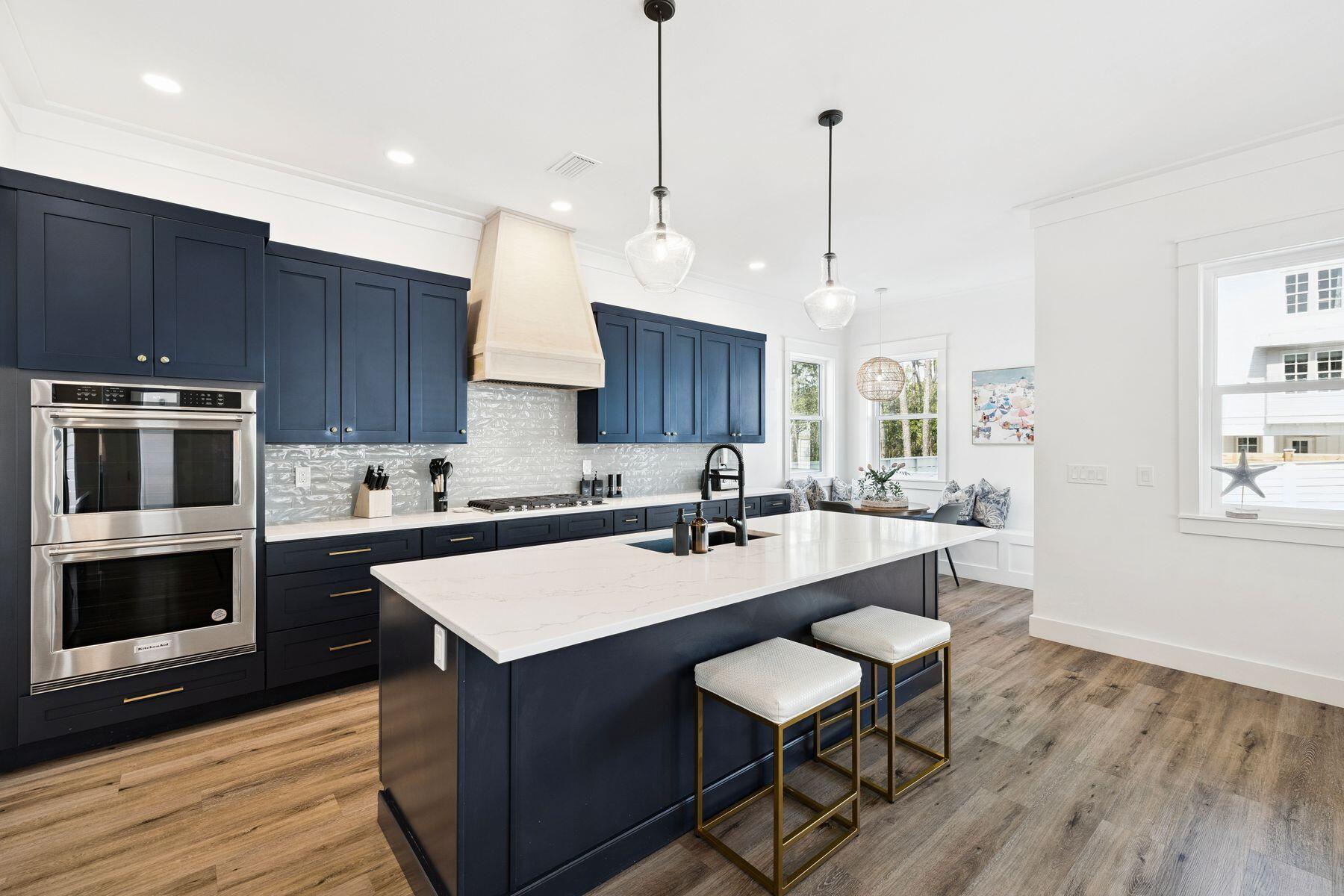 58 Santa Clara Street Santa Rosa Beach, FL 32459 - Photo 5 of 49 a kitchen with wooden floor and wooden cabinets