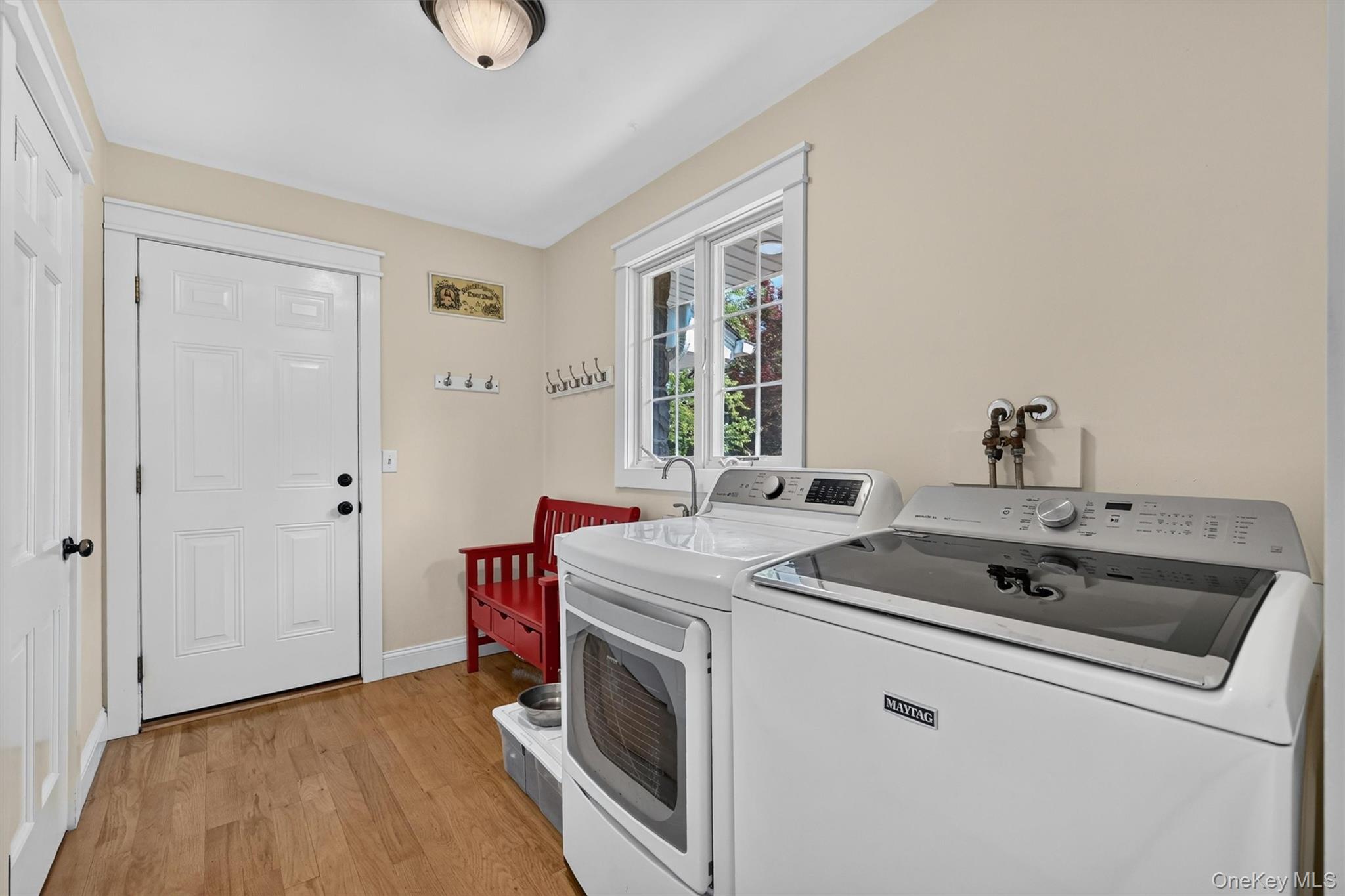 5 Hedges Road Warwick, NY 10990 - Photo 23 of 48 Positioned between the garage and kitchen, the mudroom/laundry room offers a practical drop zone with exterior access, laundry space, and a large pantry closet for added everyday storage.