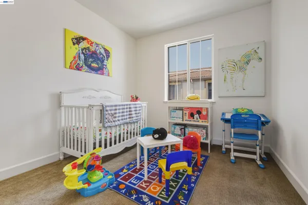a view of a livingroom with furniture and toys
