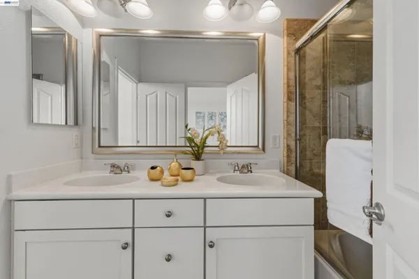 a spacious bedroom with a bed and a couch