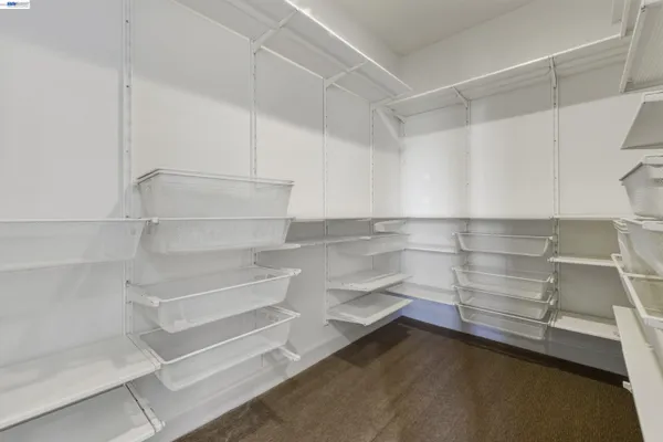a bathroom with a granite countertop sink mirror and a bathtub
