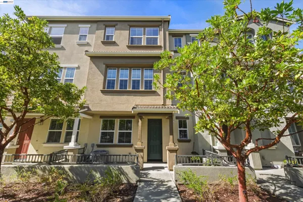 a front view of a house with garage