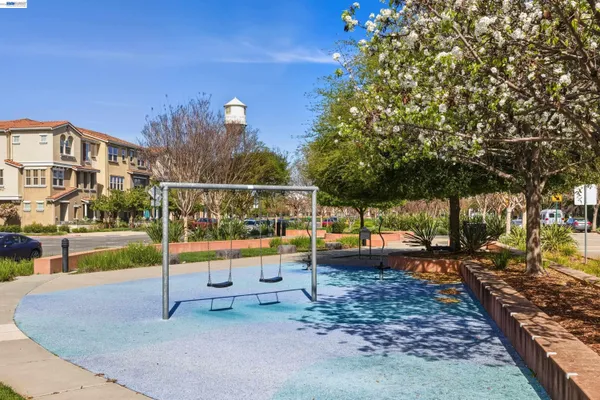 a front view of a residential apartment building with a yard