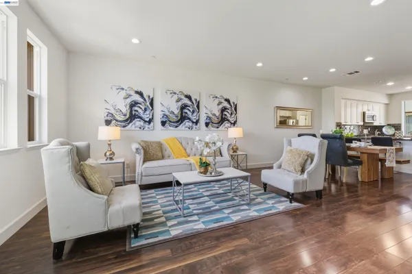 a living room with furniture and white walls