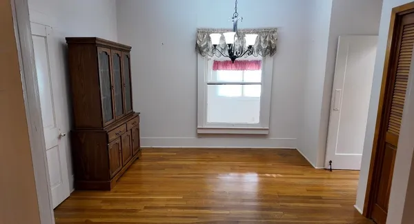 a view of a kitchen from a hallway