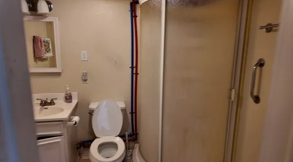 a bathroom with a toilet and a sink