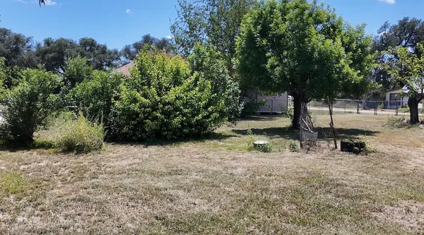 a backyard of a house with lots of green space