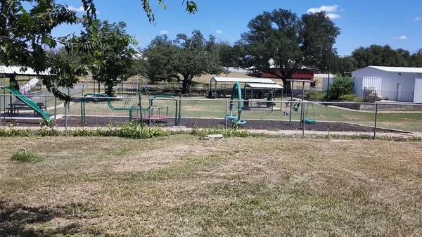 a view of backyard with green space