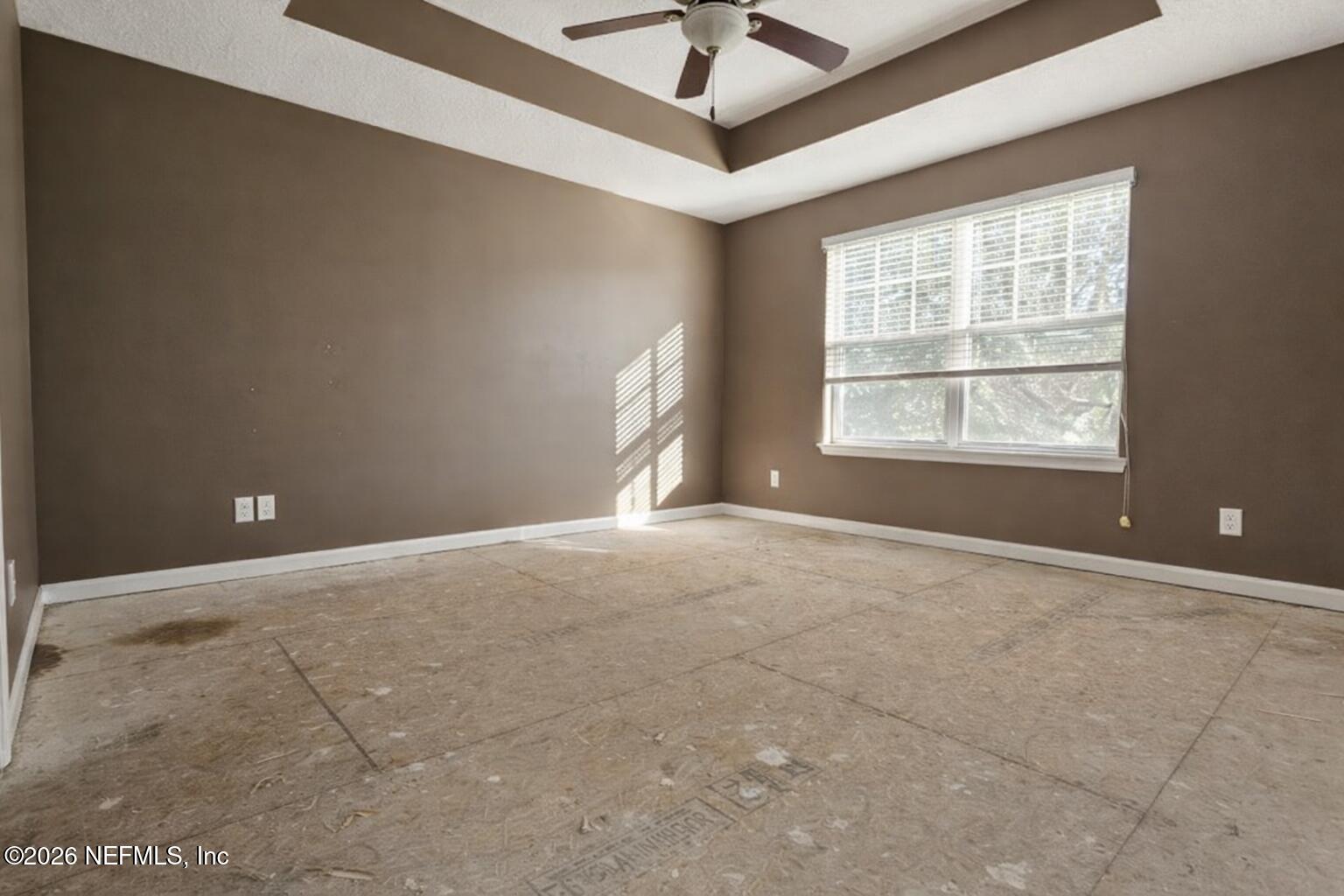217 Amber Ridge Road Jacksonville, FL 32218 - Photo 18 of 42 an empty room with a empty space and windows
