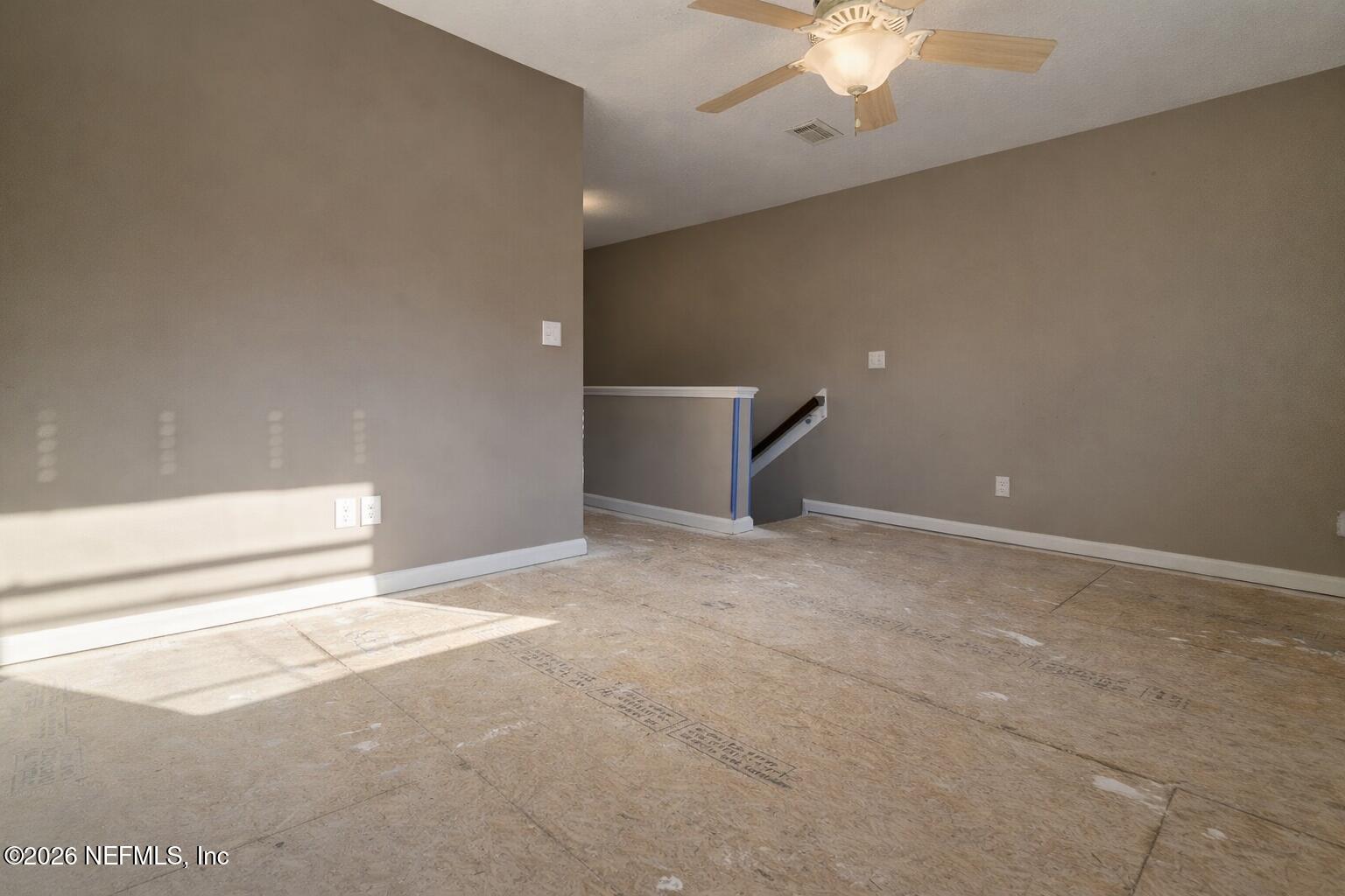 217 Amber Ridge Road Jacksonville, FL 32218 - Photo 2 of 42 a view of a livingroom with a ceiling fan and window
