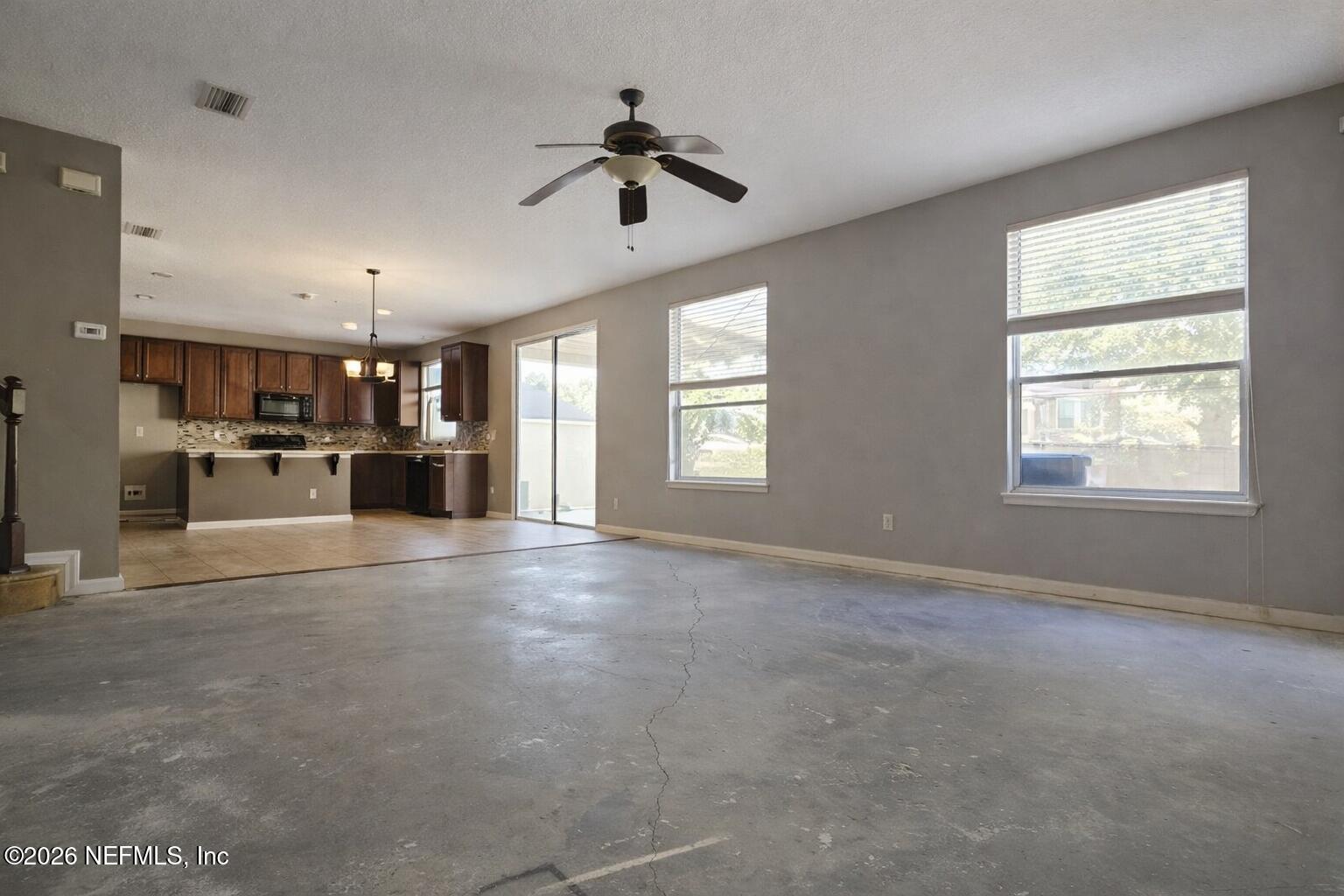 217 Amber Ridge Road Jacksonville, FL 32218 - Photo 24 of 42 a view of livingroom with hardwood floor and a ceiling fan