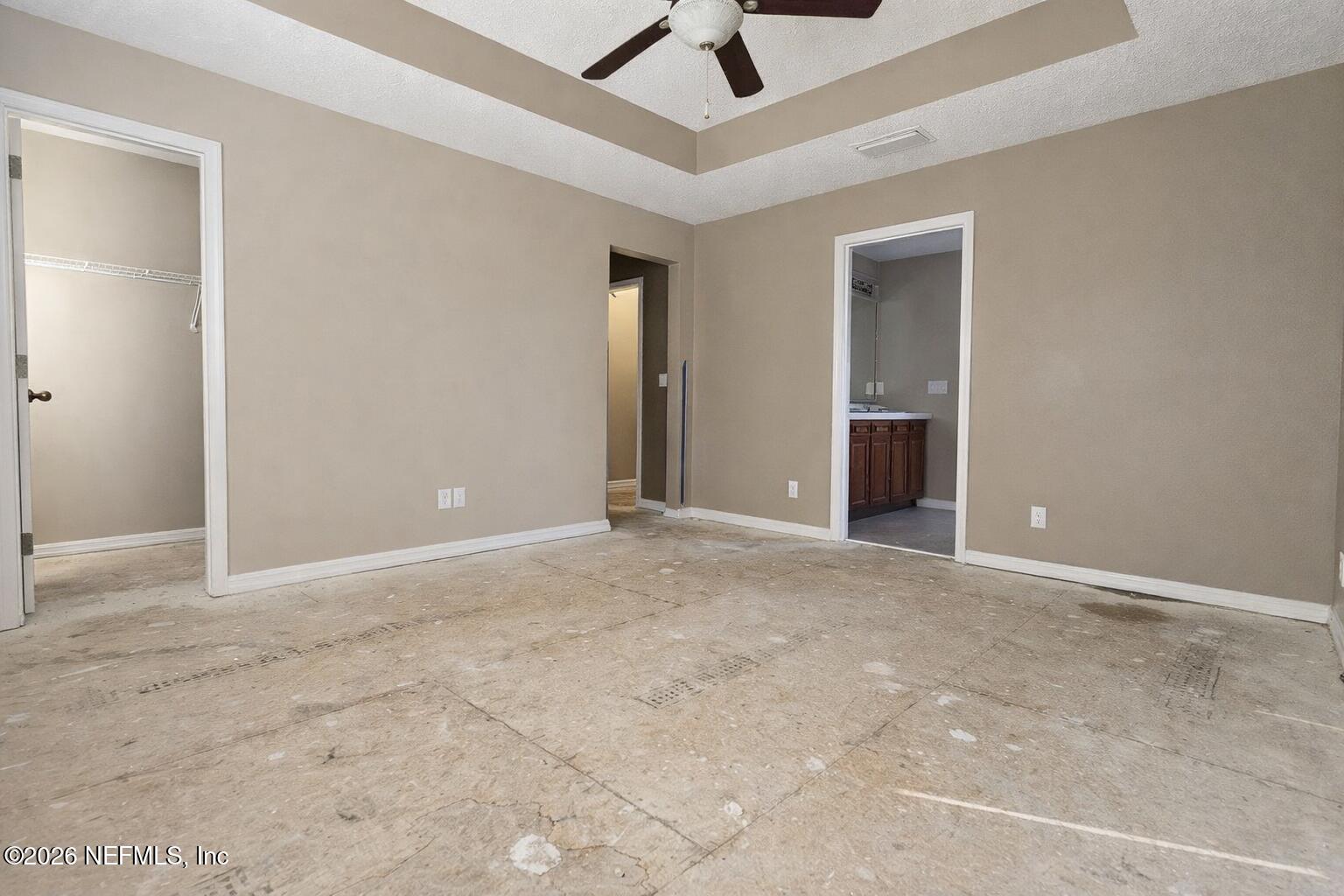 217 Amber Ridge Road Jacksonville, FL 32218 - Photo 30 of 42 an empty room with fan and windows