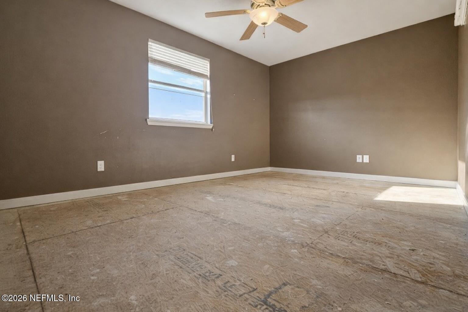 217 Amber Ridge Road Jacksonville, FL 32218 - Photo 3 of 42 a view of an empty room with a window