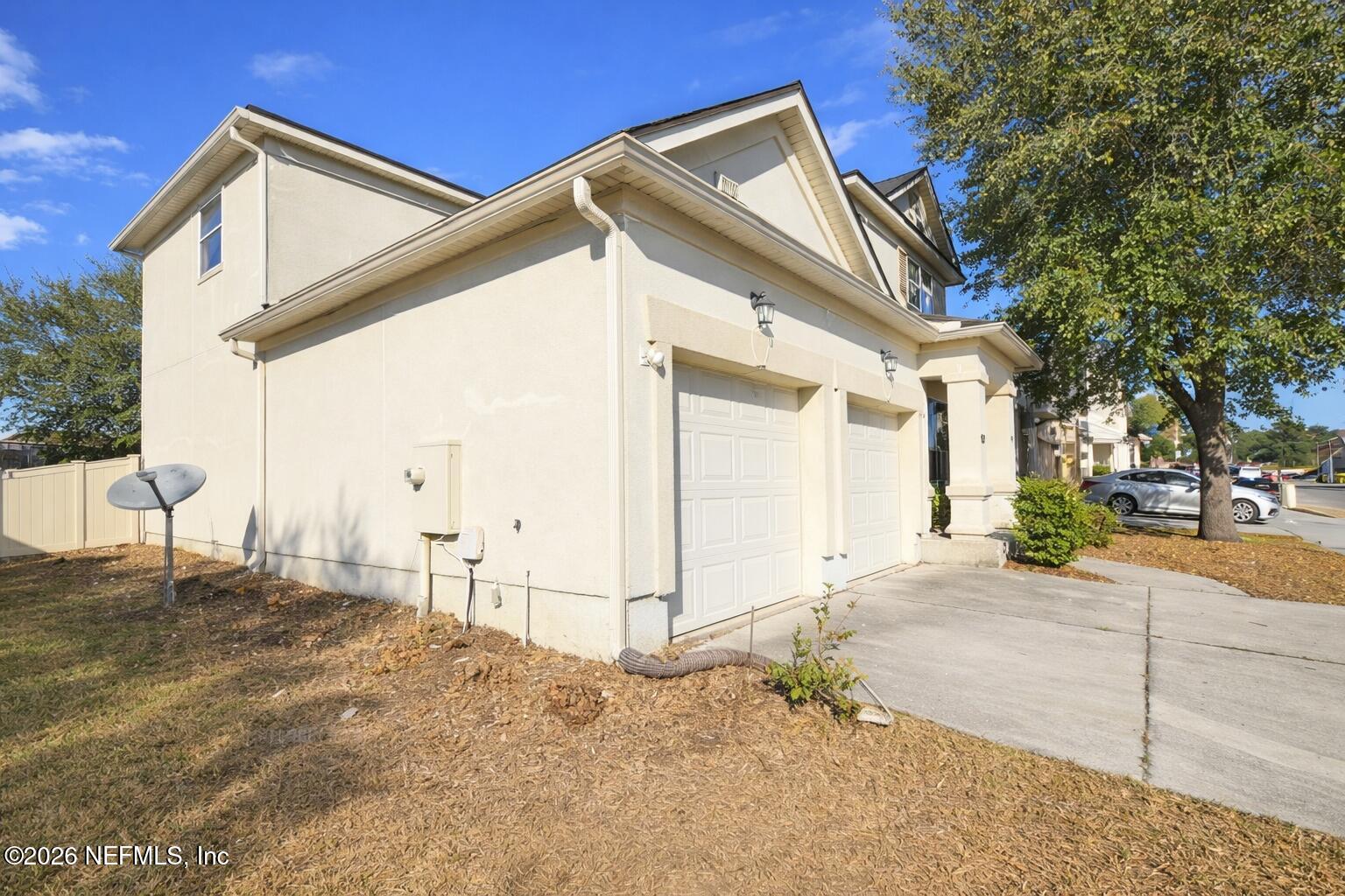 217 Amber Ridge Road Jacksonville, FL 32218 - Photo 36 of 42 a backyard of a house with garage