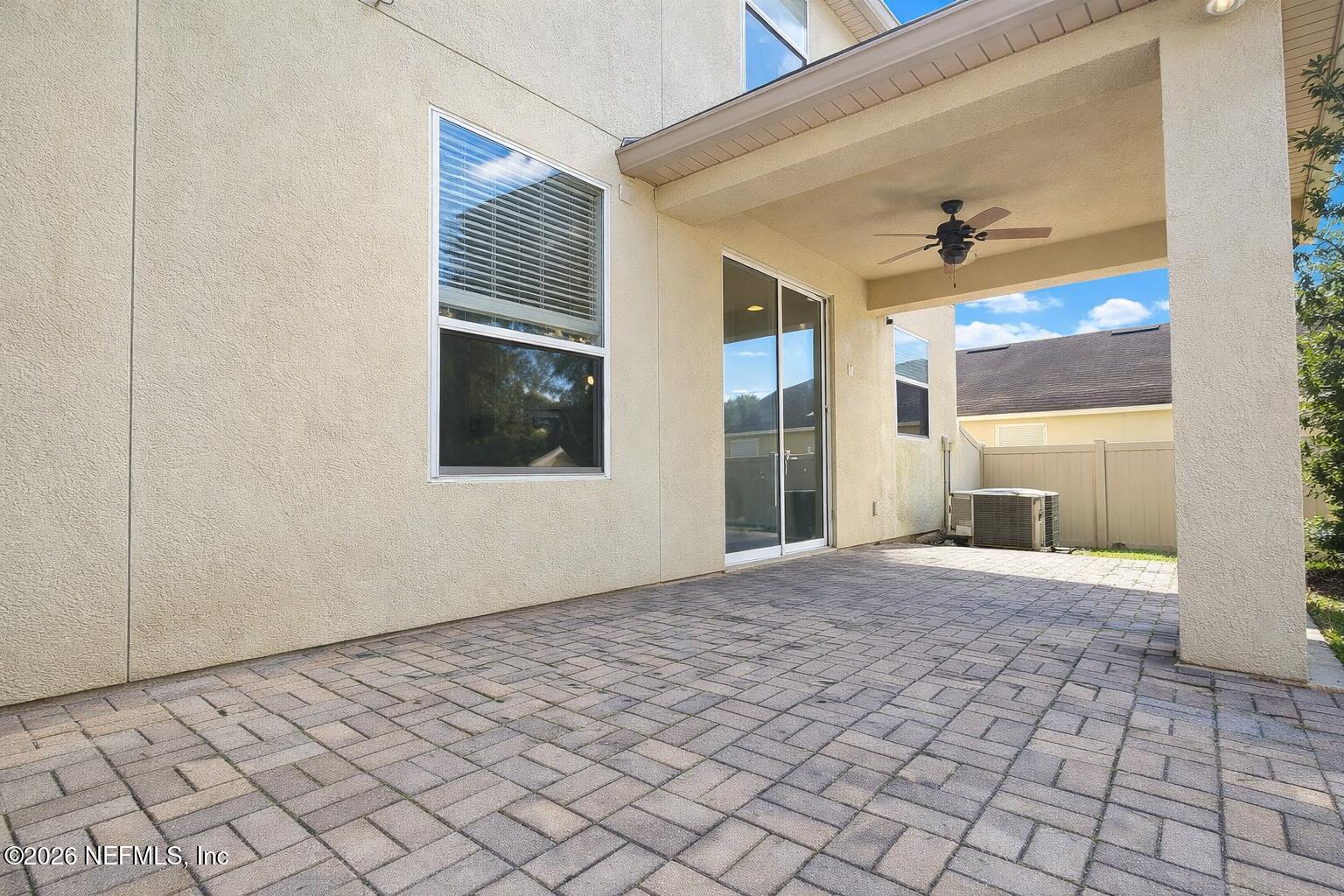 217 Amber Ridge Road Jacksonville, FL 32218 - Photo 42 of 42 a view of an empty room with window and wooden floor