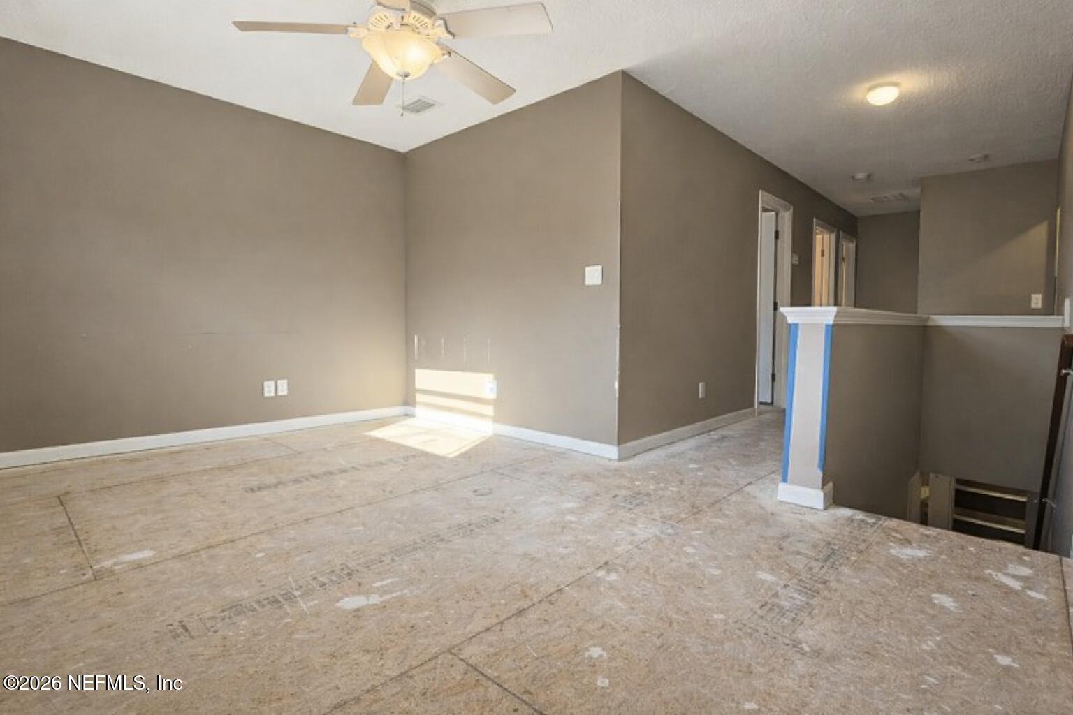 217 Amber Ridge Road Jacksonville, FL 32218 - Photo 8 of 42 a view of a livingroom with a ceiling fan and window