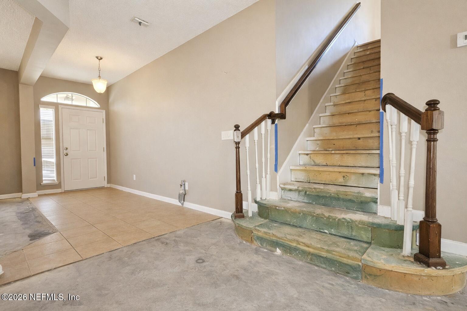 217 Amber Ridge Road Jacksonville, FL 32218 - Photo 10 of 42 a view of a livingroom with stairs