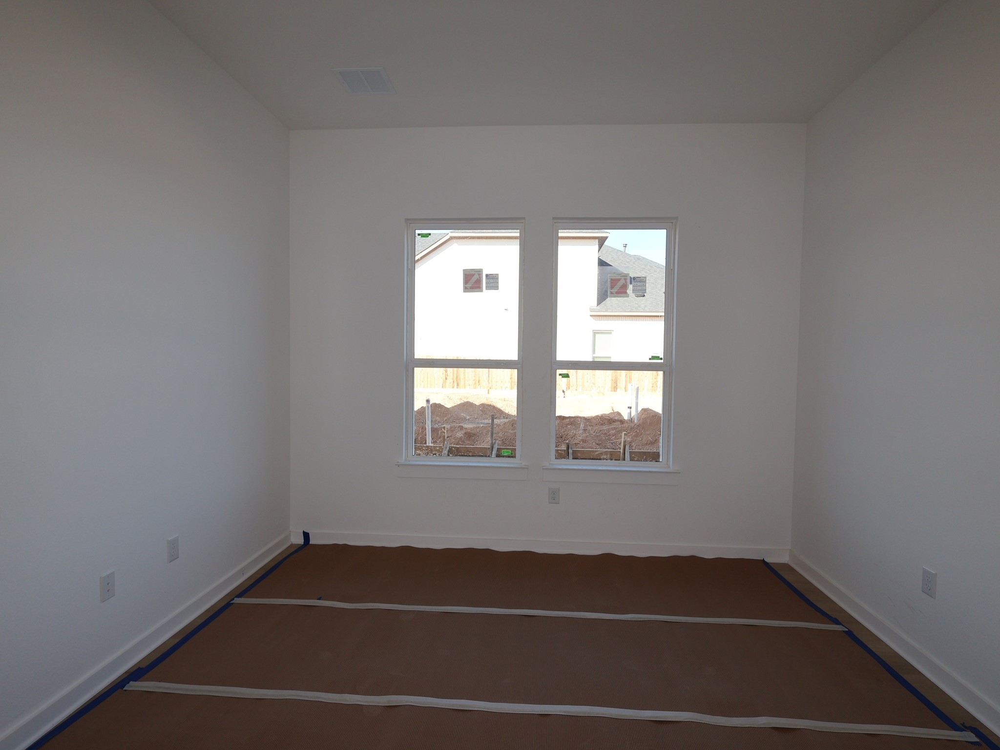 900 Purmela Street Leander, TX 78641 - Photo 6 of 13 a view of a room with rack on the wall and a window