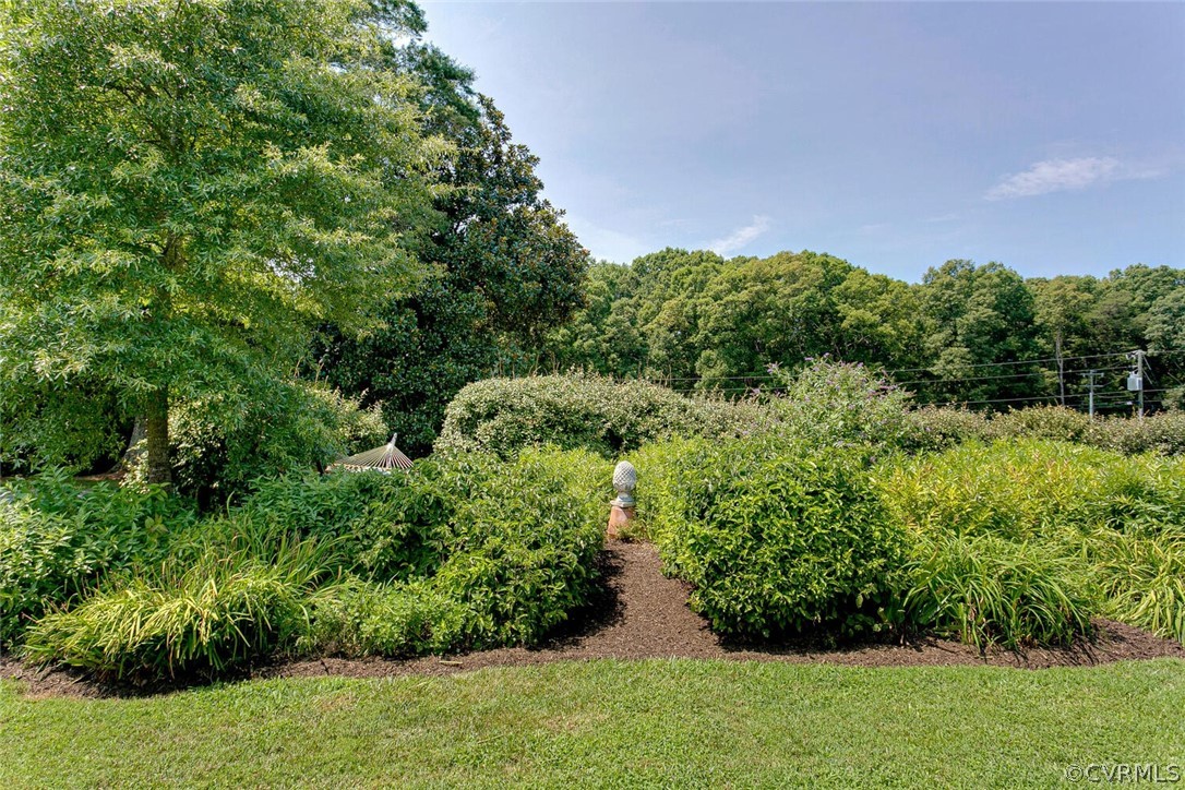 1161 Manakin Road Manakin-Sabot, VA 23103 - Photo 44 of 50 Garden with walkway and flowering shrubs.