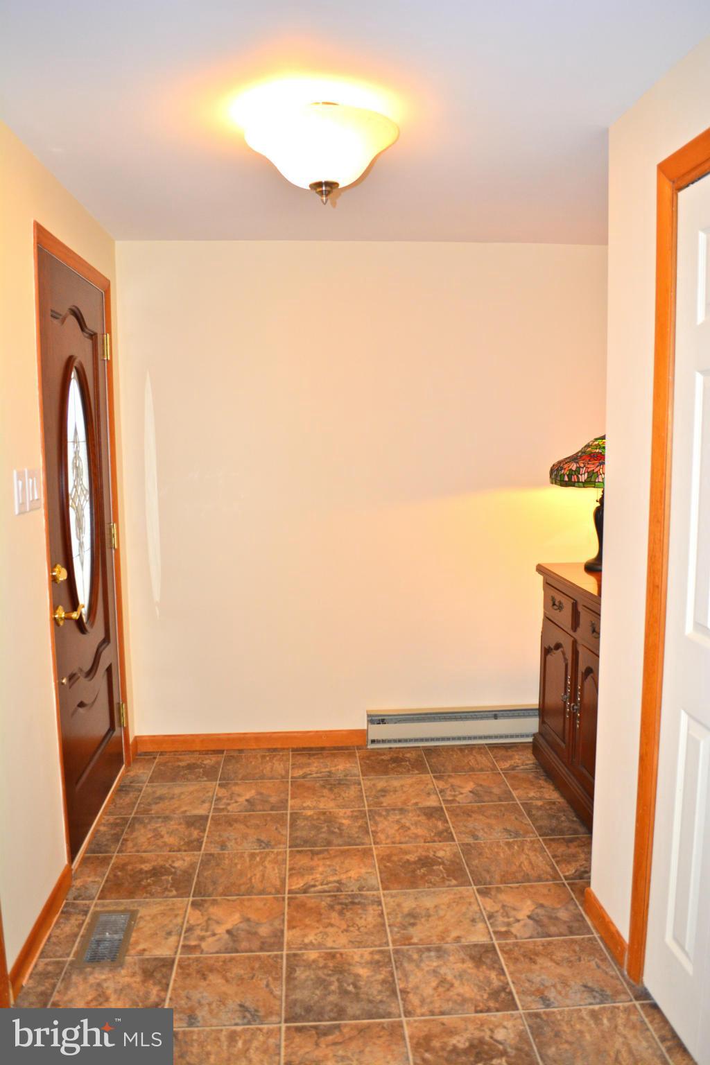 27817 Barnes Road Damascus, MD 20872 - Photo 2 of 30 Foyer Entrance with new hardwood front door