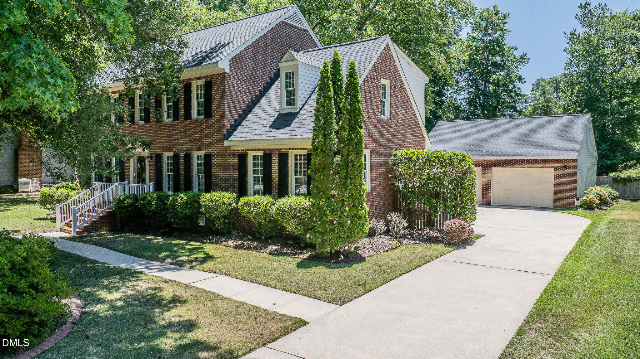 1215 Cambridge Road Northwest Wilson, NC 27896 - Photo 3 of 54 a front view of a house with a garden