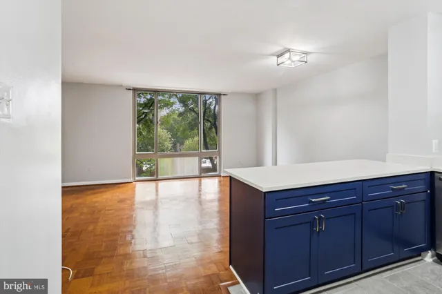a kitchen with stainless steel appliances a refrigerator stove and microwave