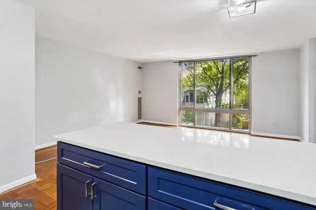 a view of an empty room with a window