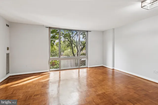 a kitchen with granite countertop a sink and stainless steel appliances