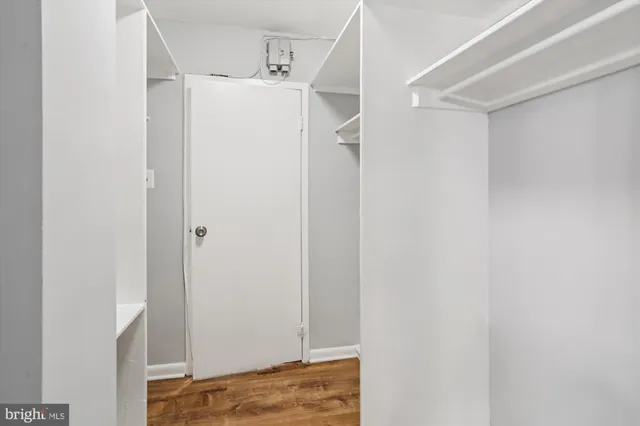 a room with gym equipment and a large window