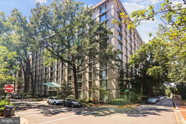 a view of hallway with wooden floor