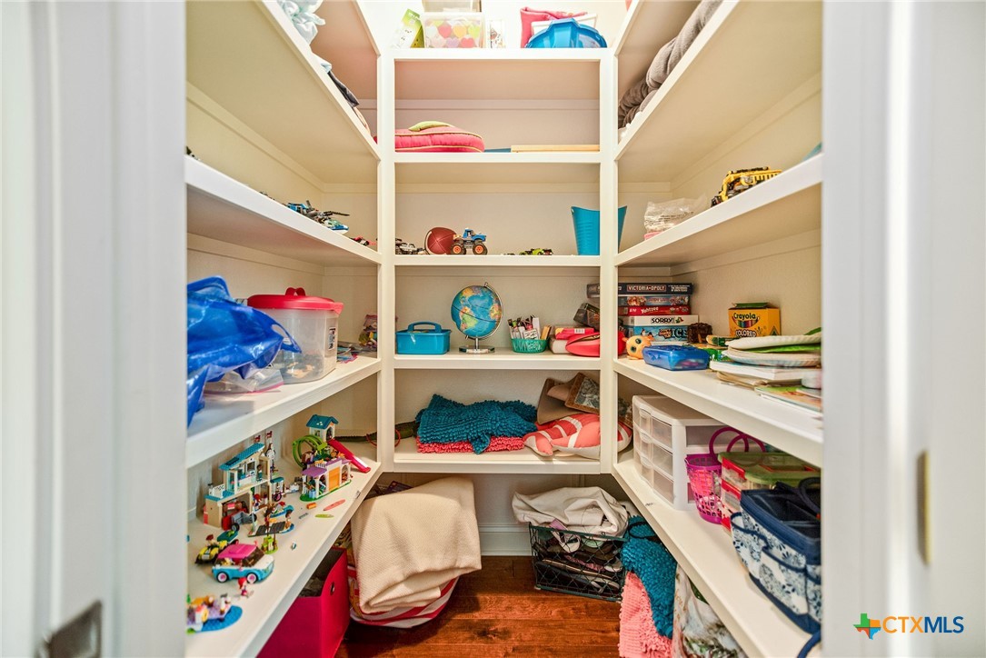 23 Macey Street Port O'Connor, TX 77982 - Photo 27 of 47 a utility room with lots of clutter and cabinets