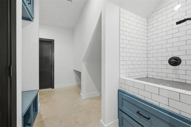 a kitchen with stainless steel appliances granite countertop a stove and a refrigerator