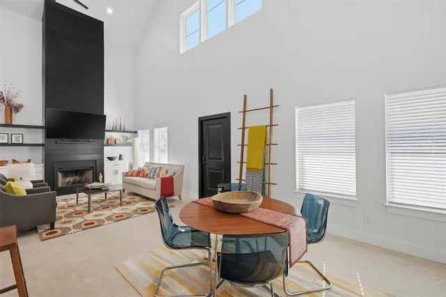 a living room with fireplace furniture and a flat screen tv