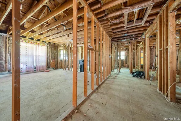 a view of a hallway with wooden walls