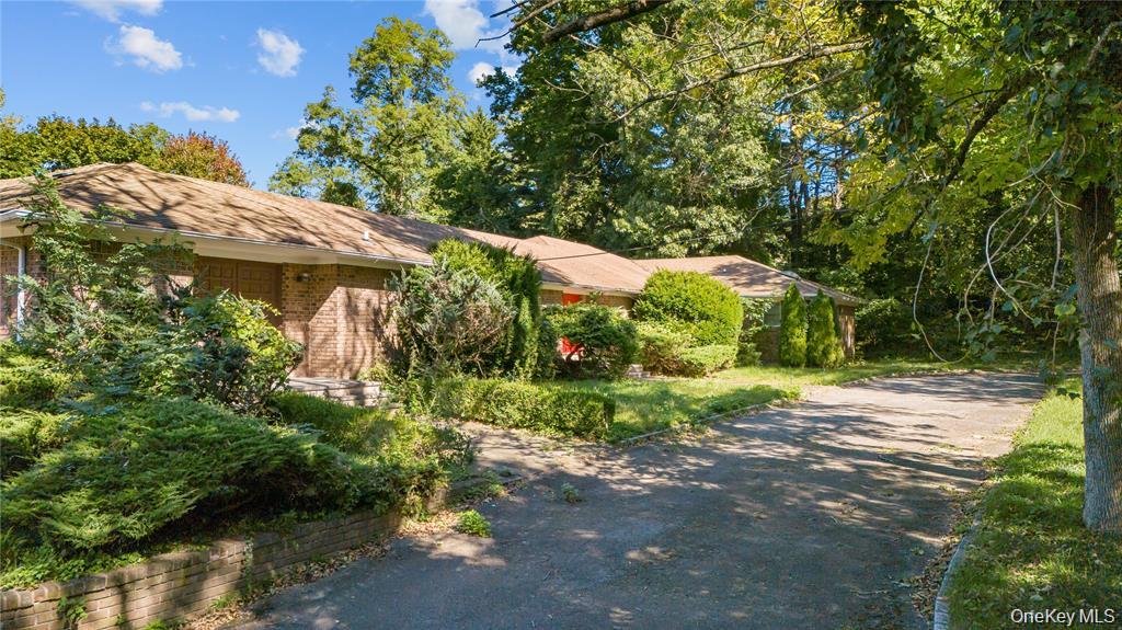 169 Middle Neck Road Sands Point, NY 11050 - Photo 8 of 15 a backyard of a house with lots of green space