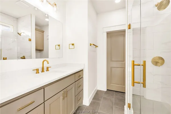 a bathroom with a sink and a mirror