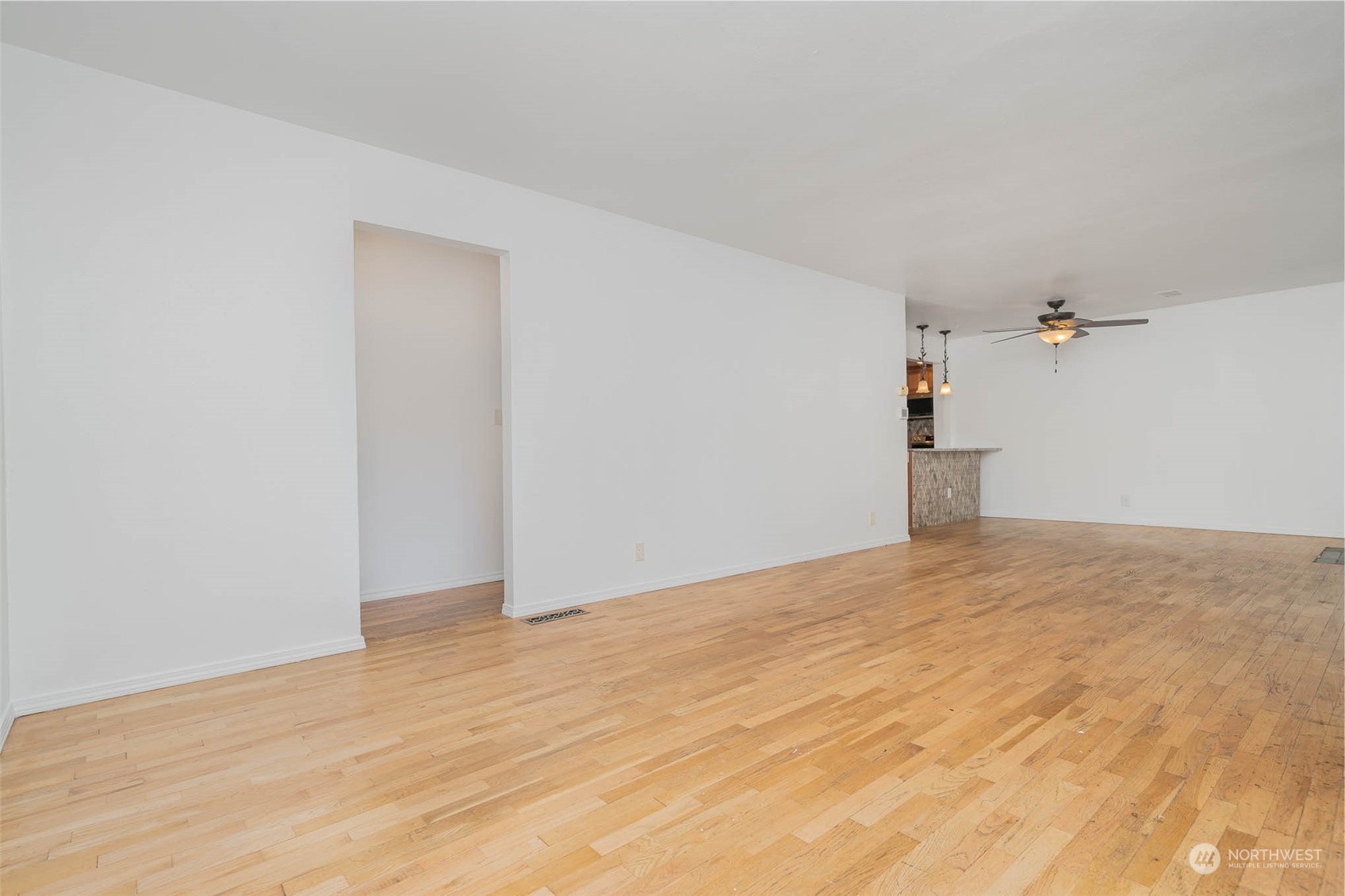 1709 Edmonds Avenue Northeast Renton, WA 98056 - Photo 11 of 31 a view of empty room with wooden floor