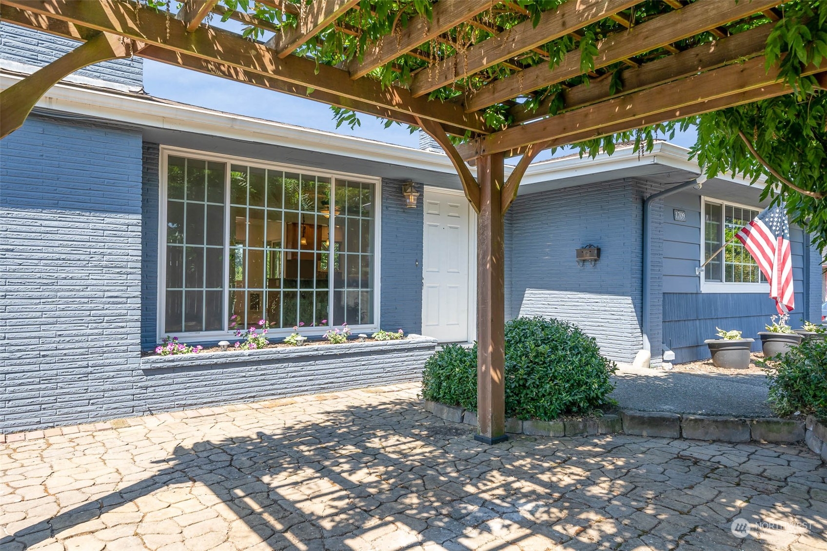 1709 Edmonds Avenue Northeast Renton, WA 98056 - Photo 2 of 31 a front view of a house with a yard