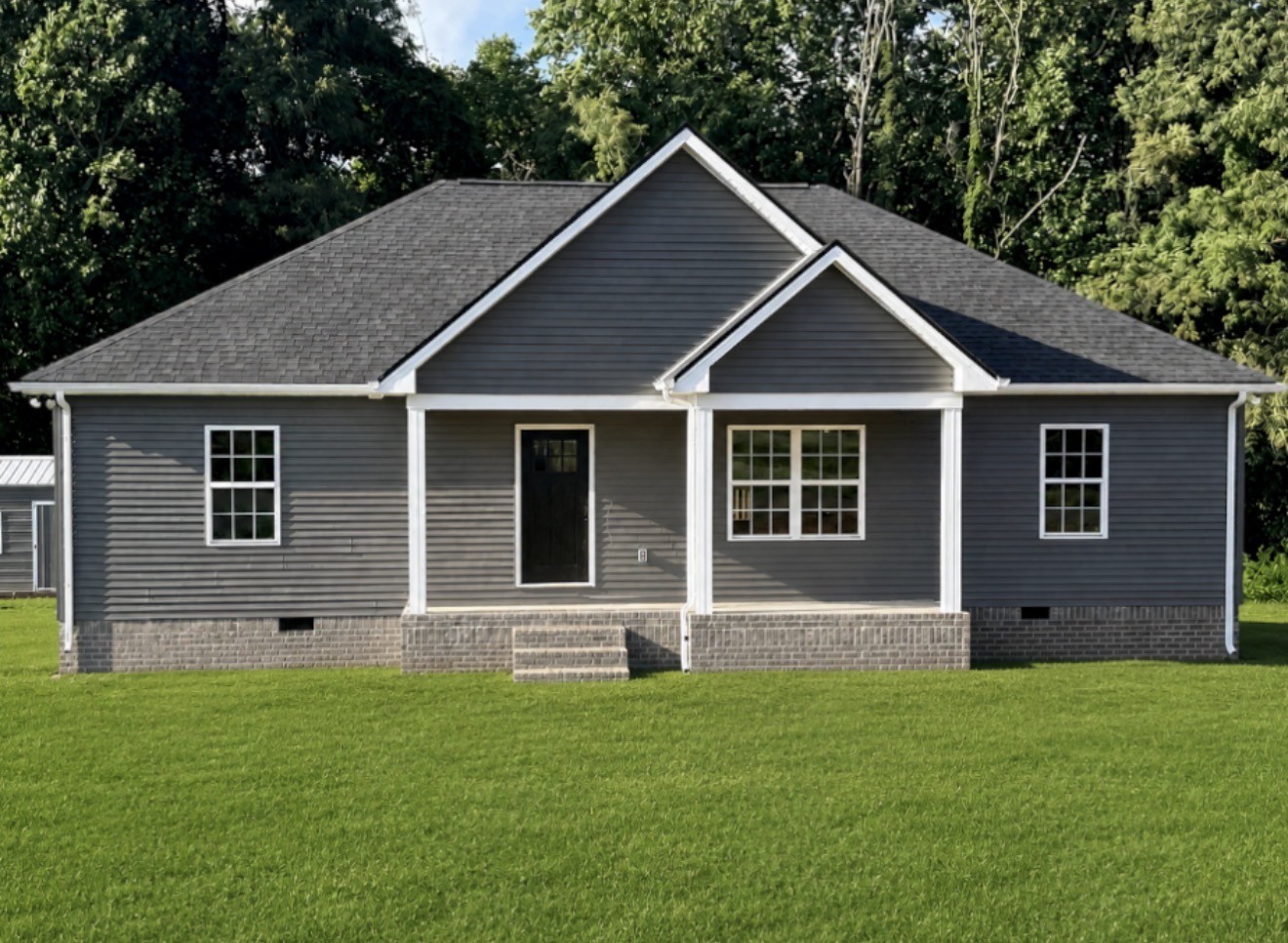 71 Iris Way Lafayette, TN 37083 - Photo 1 of 1 a front view of a house with a garden
