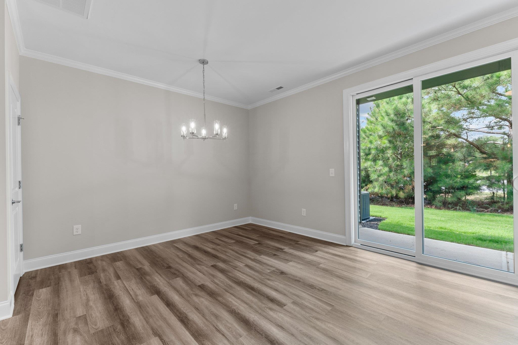 609 Marshskip Way, Unit 5 Rolesville, NC 27571 - Photo 10 of 39 a view of room with window and hardwood